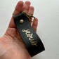 christlicher Schlüsselanhänger aus schwarzen Leder mit Goldschrift "jesus"