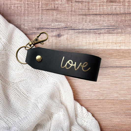 christlicher Schlüsselanhänger aus schwarzem Leder mit Goldschrift "love"